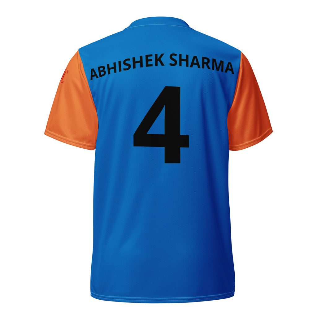 Cachy’s Urban blue and orange short-sleeve sports jersey with black cricket player graphic and “Kricket” text