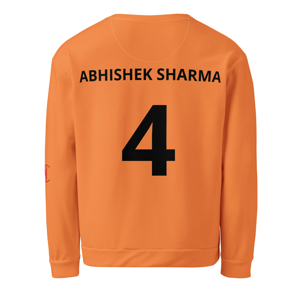 Cachy’s Urban orange sweatshirt with bold “Kricket” text repeat and cricket player graphic print