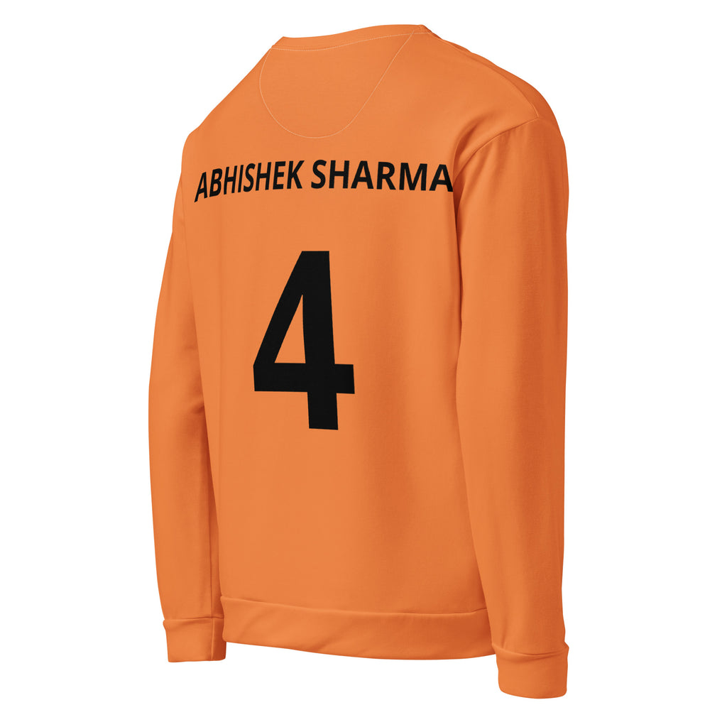 Cachy’s Urban orange sweatshirt with bold “Kricket” text repeat and cricket player graphic print