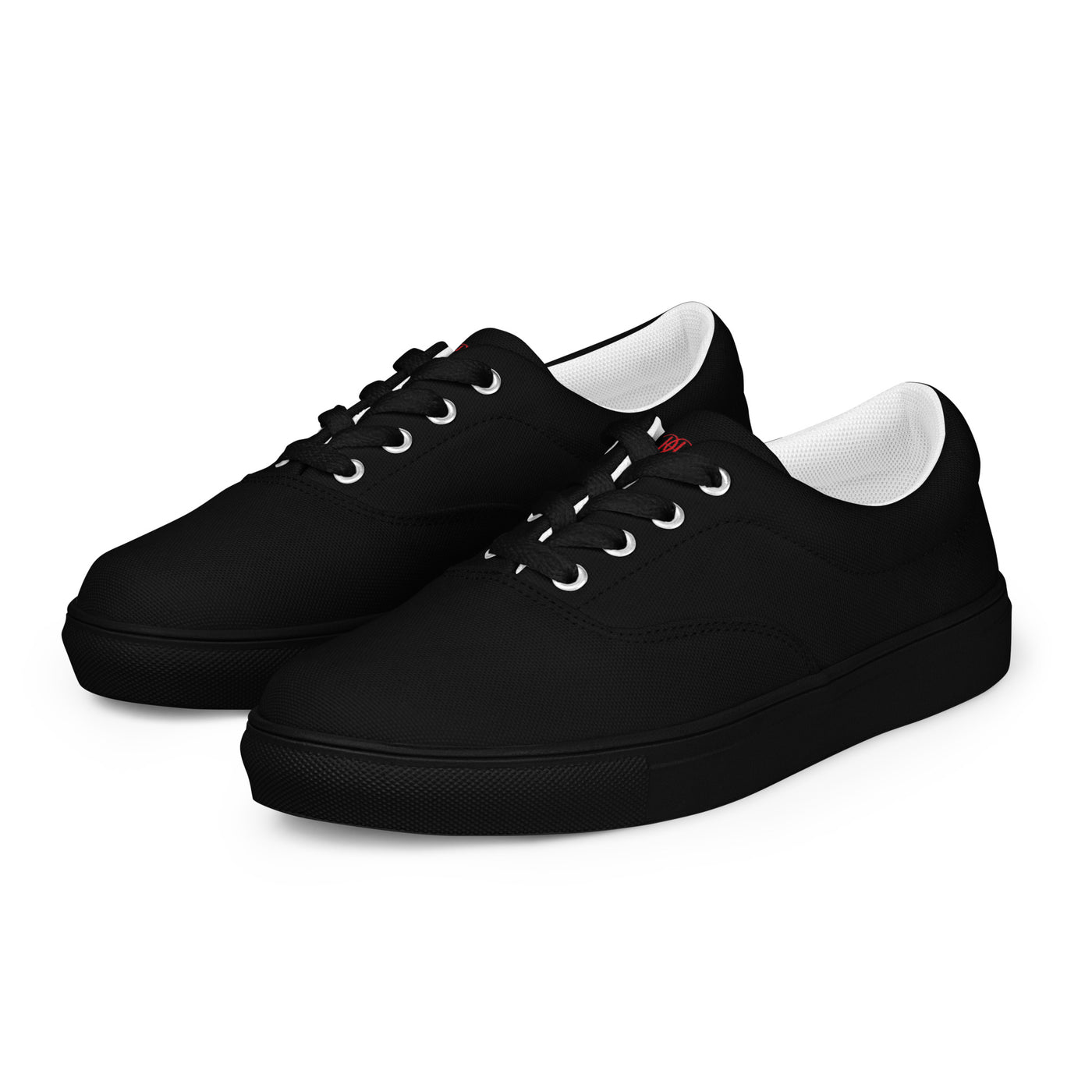 Black lace-up canvas sneakers with subtle red Cachy’s Urban logo on the tongue