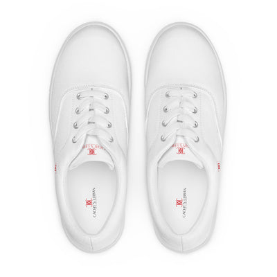 White lace-up canvas sneakers with red Cachy’s Urban logo on the side