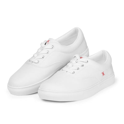 White lace-up canvas sneakers with red Cachy’s Urban logo on the side