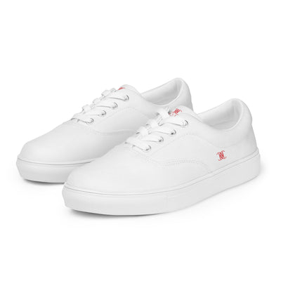 White lace-up canvas sneakers with red Cachy’s Urban logo on the side