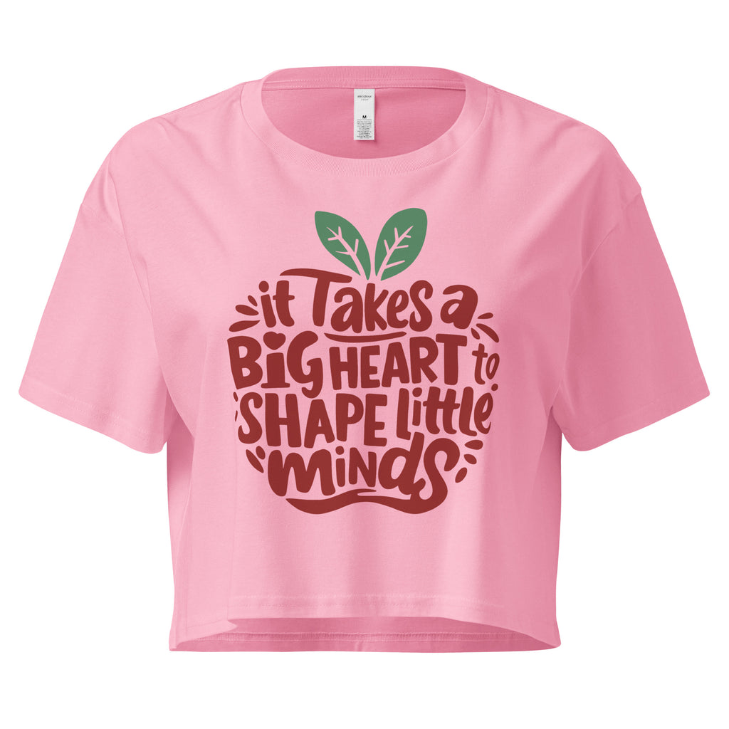 Cachy’s Urban cropped t-shirt with “It Takes a Big Heart to Shape Little Minds” apple graphic print, available in multiple colours