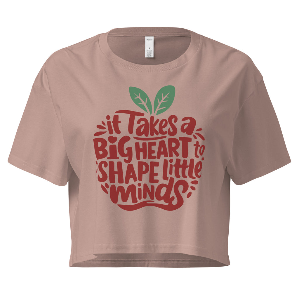 Cachy’s Urban cropped t-shirt with “It Takes a Big Heart to Shape Little Minds” apple graphic print, available in multiple colours