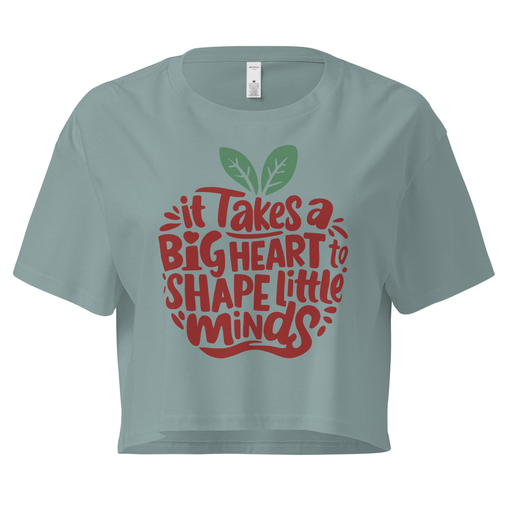 Cachy’s Urban cropped t-shirt with “It Takes a Big Heart to Shape Little Minds” apple graphic print, available in multiple colours