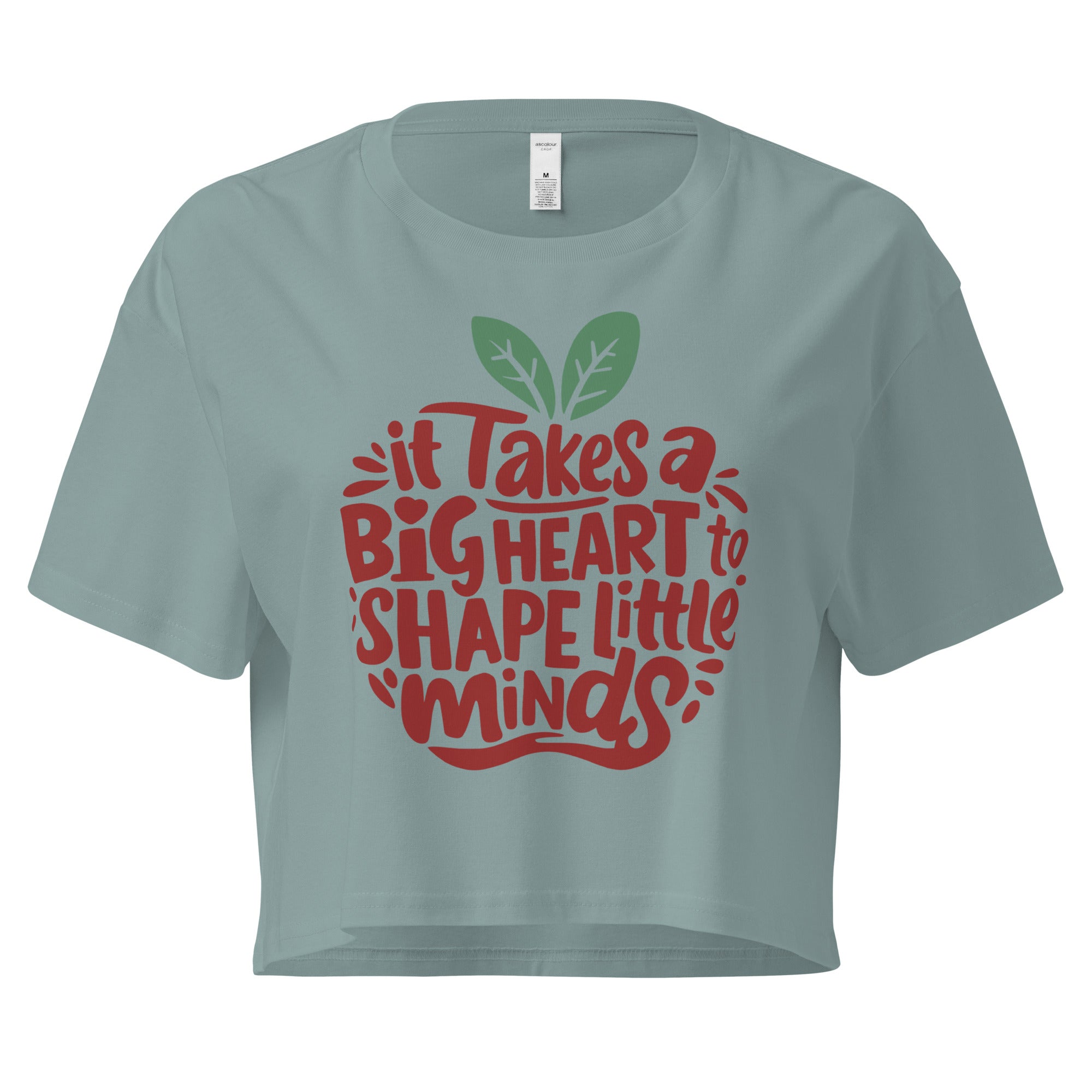 Cachy’s Urban cropped t-shirt with “It Takes a Big Heart to Shape Little Minds” apple graphic print, available in multiple colours
