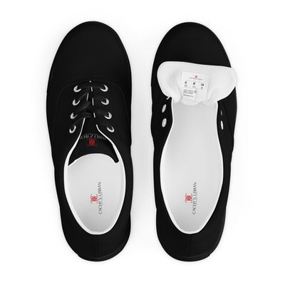 All-black lace-up canvas sneakers with subtle red Cachy’s Urban branding on the tongue and white inner lining