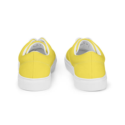 Yellow lace-up canvas sneakers with white laces, white soles, and Cachy’s Urban branded insoles