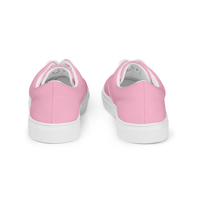 Bright pink lace-up canvas sneakers with white laces, white soles, and Cachy’s Urban branded insoles