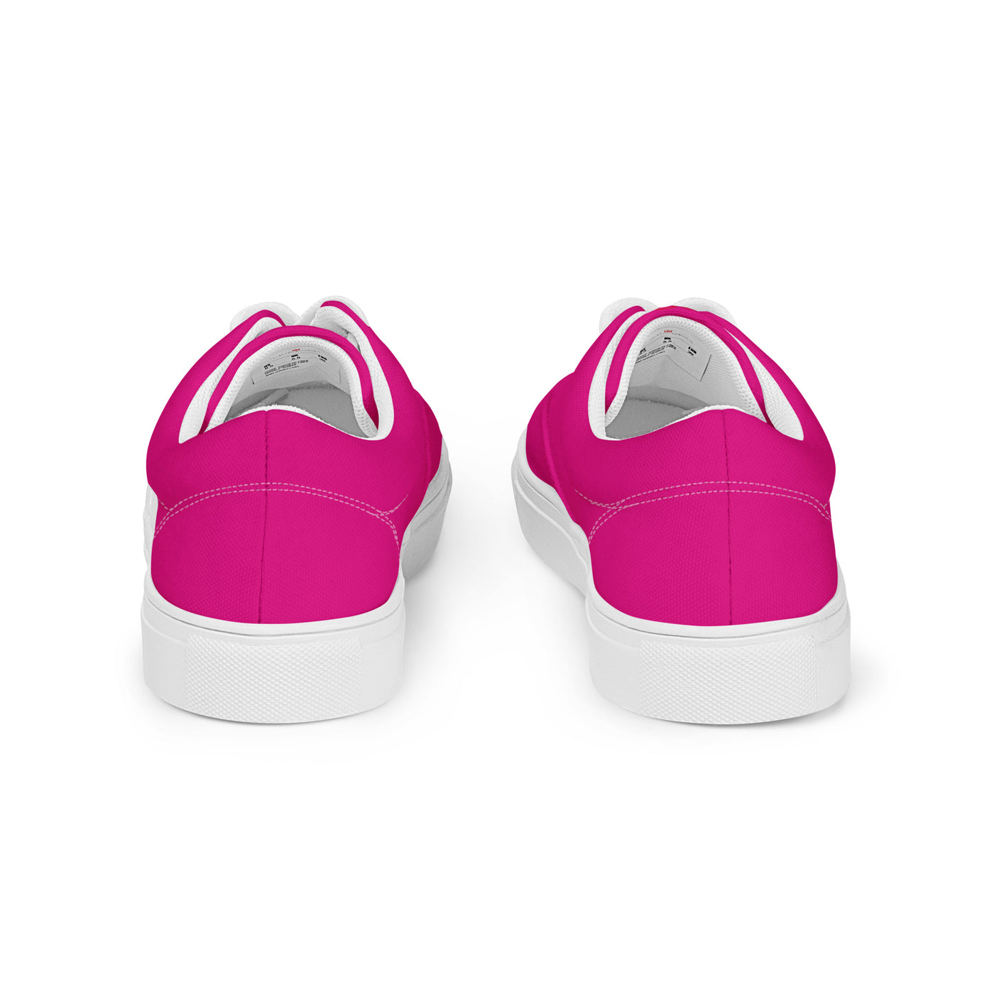 Bright pink lace-up canvas sneakers with white laces, white soles, and Cachy’s Urban branded insoles