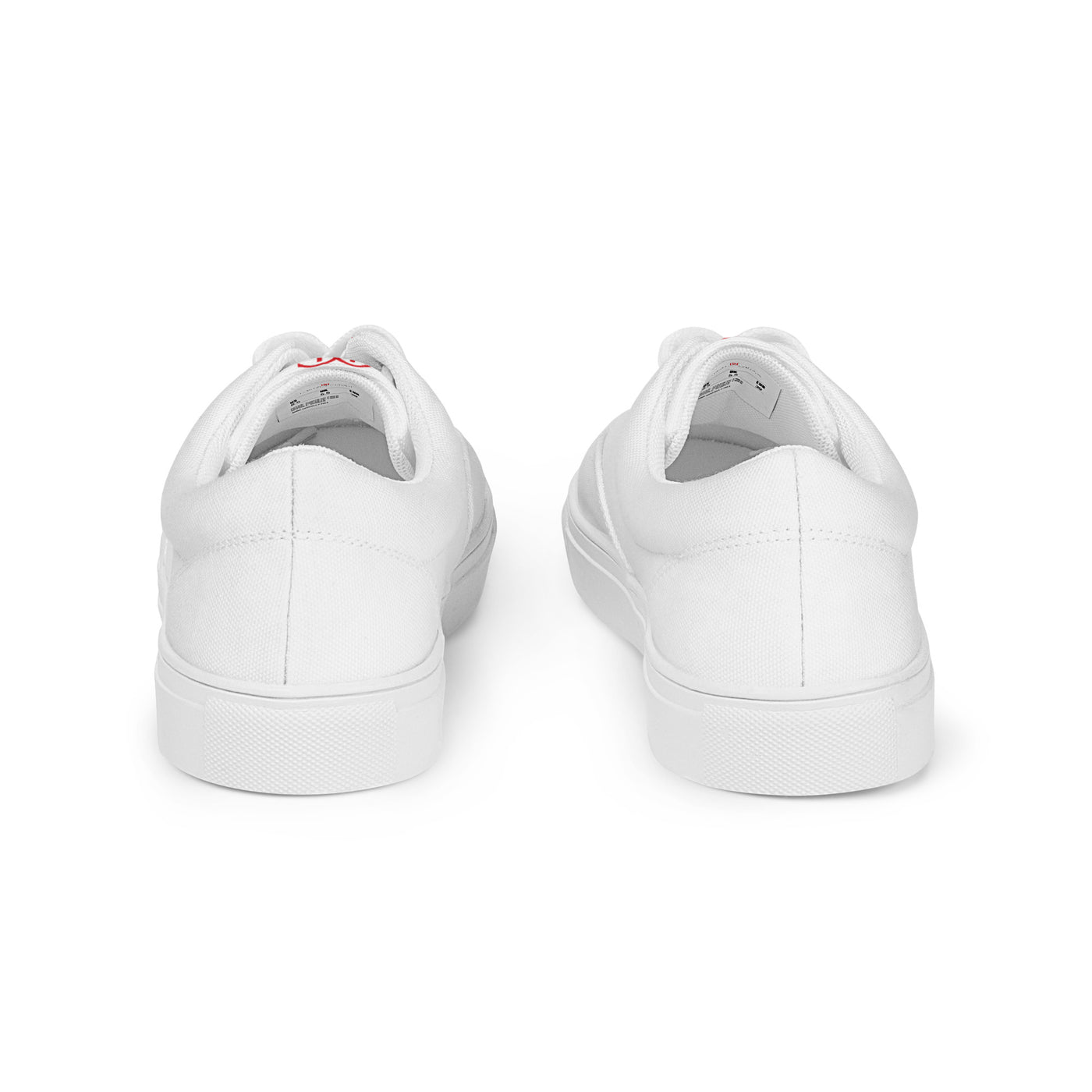 All-white lace-up canvas sneakers with minimalist design and subtle red Cachy’s Urban branding on the tongue