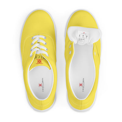 Yellow lace-up canvas sneakers with white laces, white soles, and Cachy’s Urban branded insoles