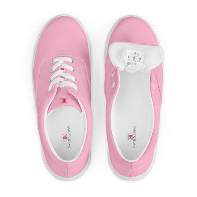 Bright pink lace-up canvas sneakers with white laces, white soles, and Cachy’s Urban branded insoles
