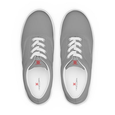 Grey lace-up canvas sneakers with white laces, white soles, and Cachy’s Urban branded insoles