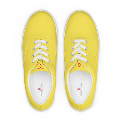 Yellow lace-up canvas sneakers with white laces, white soles, and Cachy’s Urban branded insoles