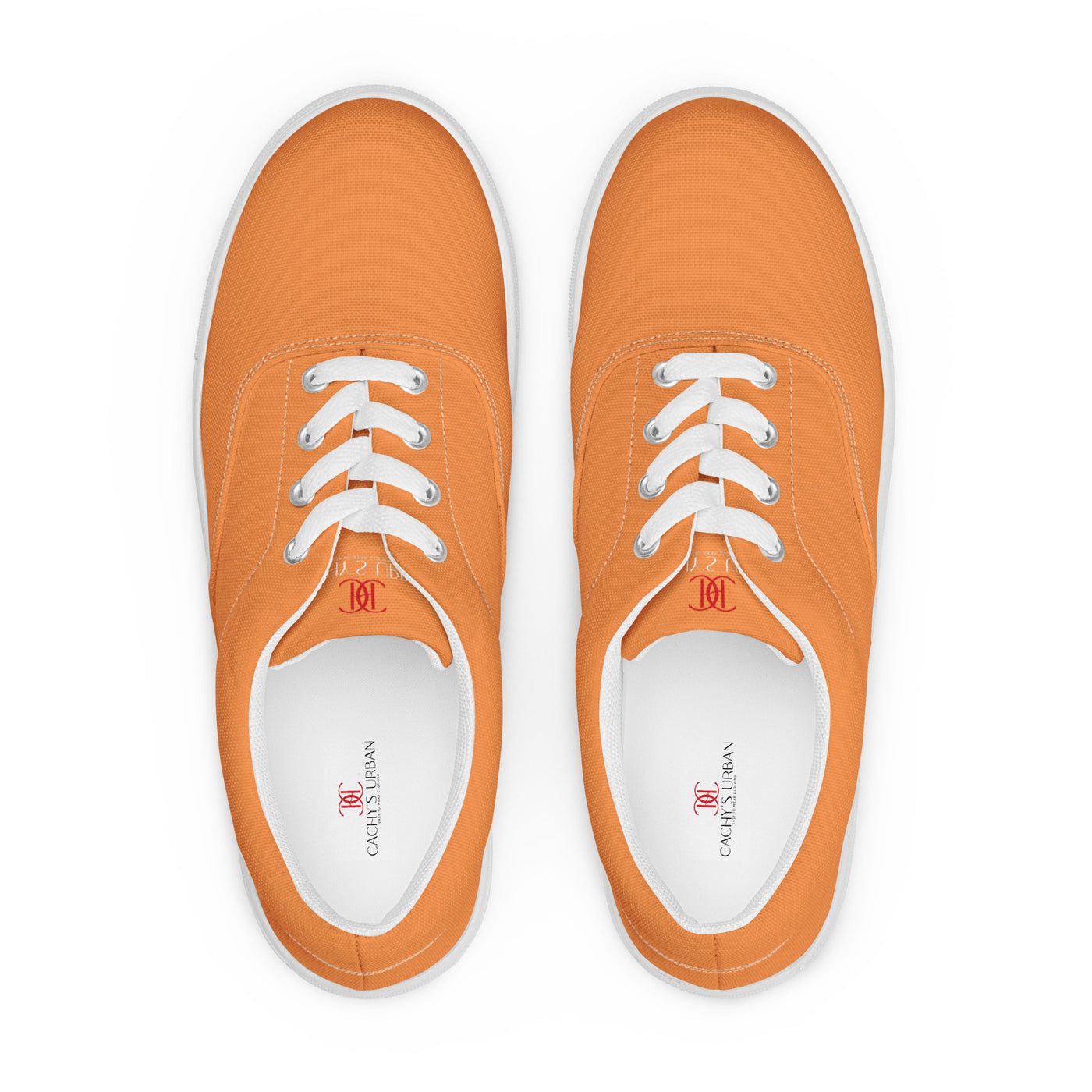 Orange lace-up canvas sneakers with white laces, white soles, and Cachy’s Urban branded insoles