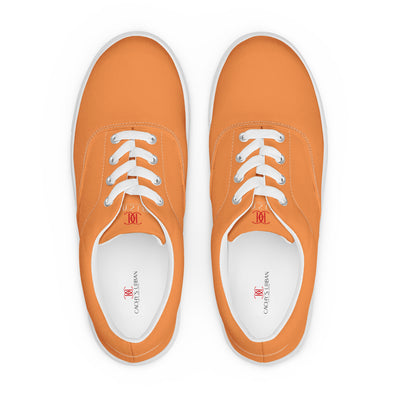 Orange lace-up canvas sneakers with white laces, white soles, and Cachy’s Urban branded insoles