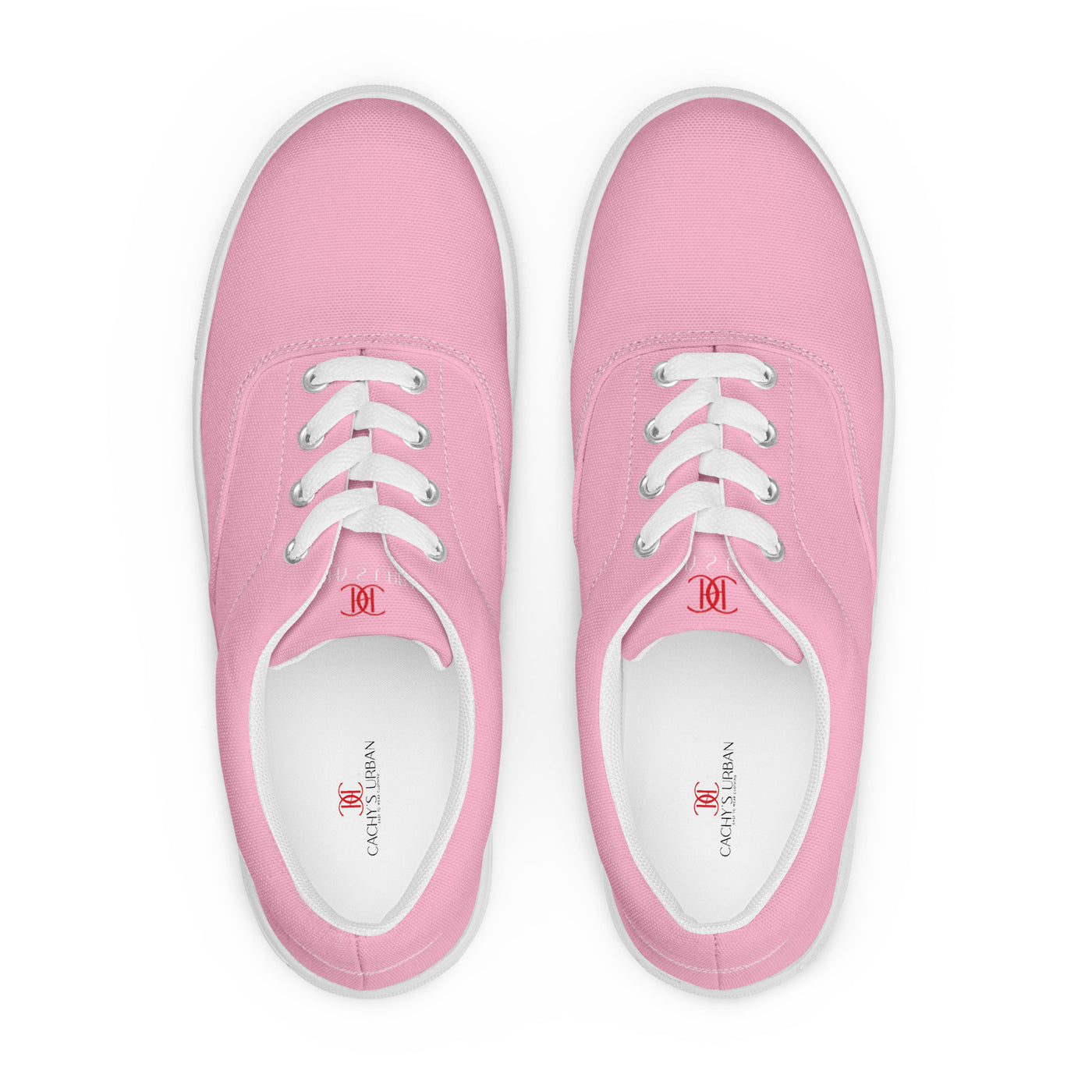Bright pink lace-up canvas sneakers with white laces, white soles, and Cachy’s Urban branded insoles