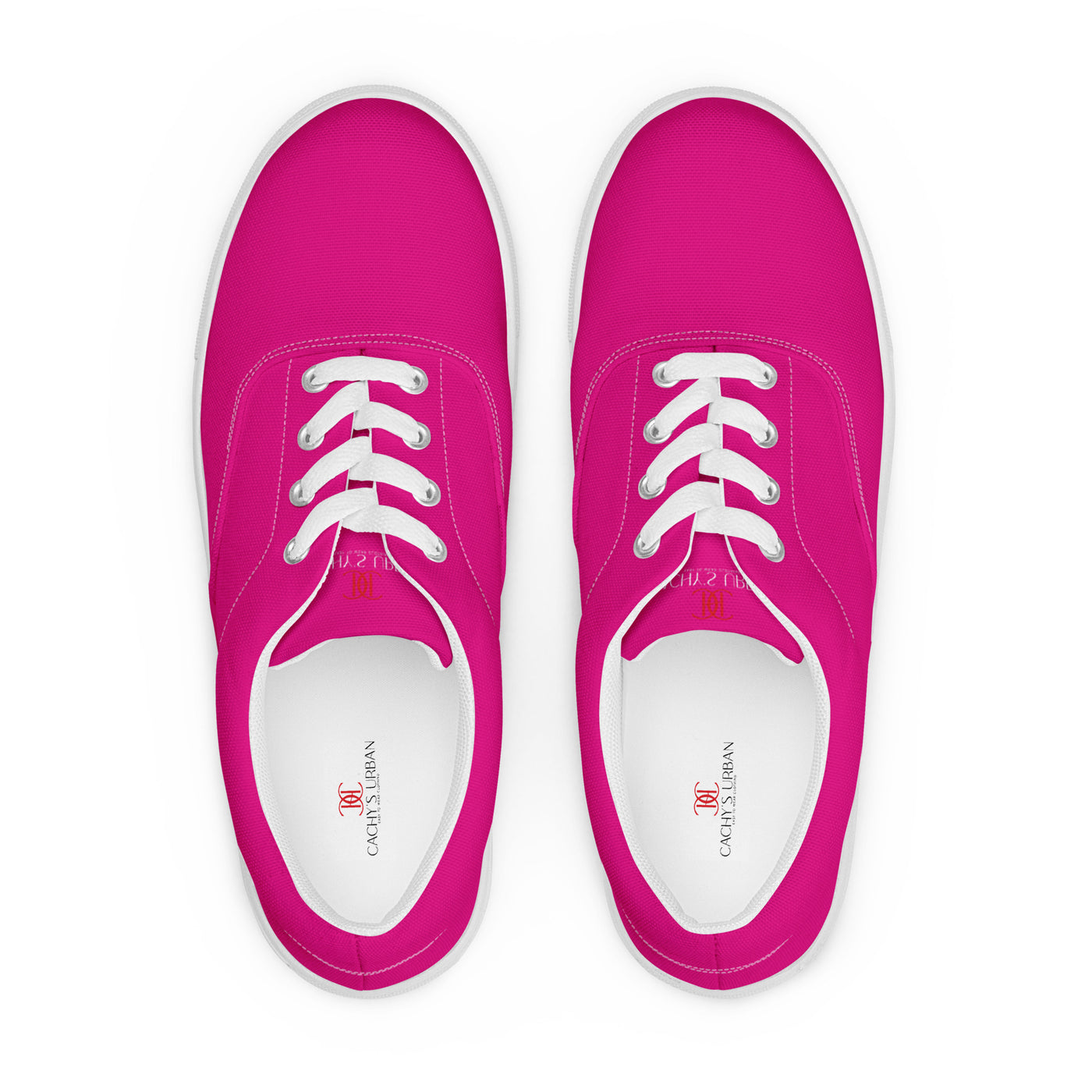 Bright pink lace-up canvas sneakers with white laces, white soles, and Cachy’s Urban branded insoles