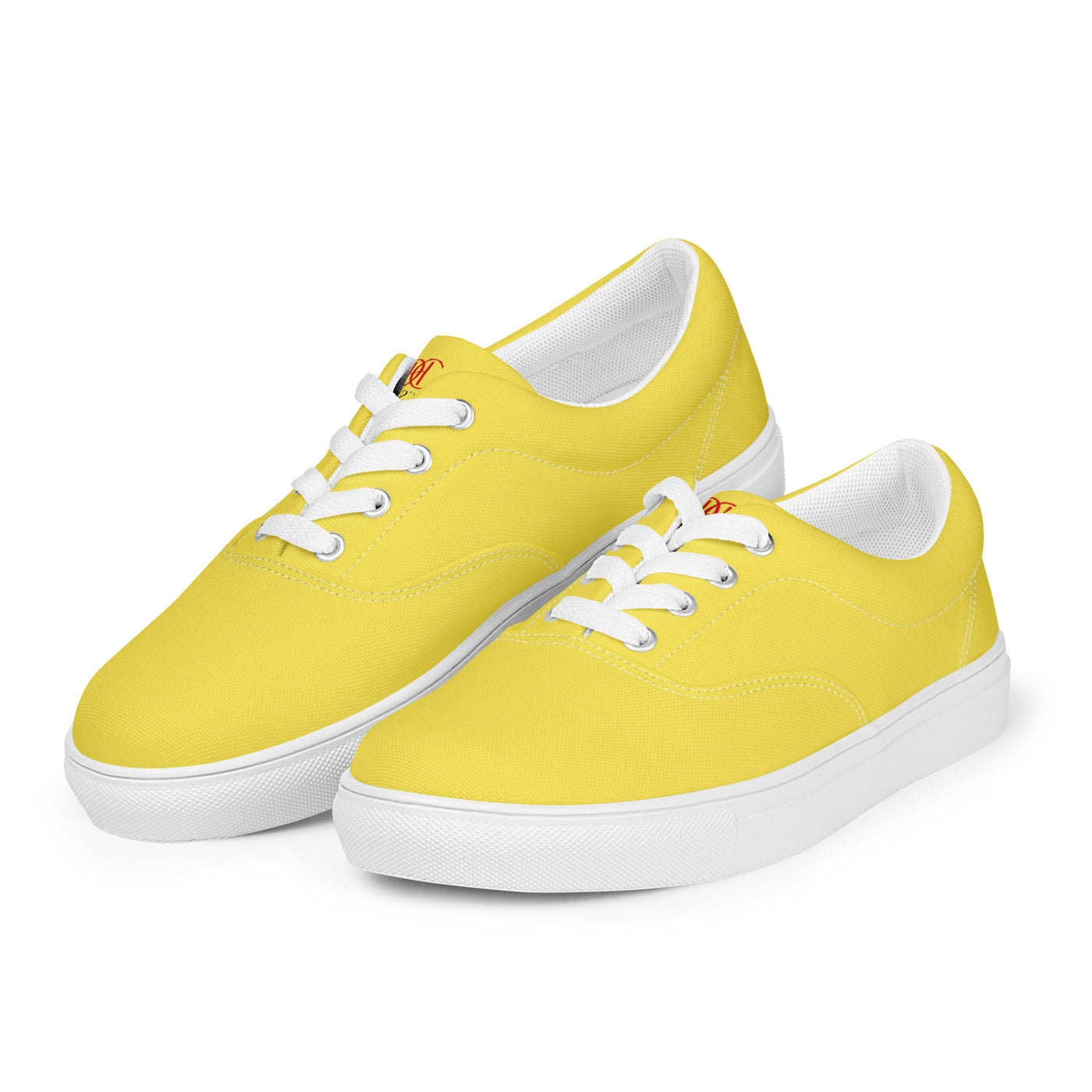 Yellow lace-up canvas sneakers with white laces, white soles, and Cachy’s Urban branded insoles