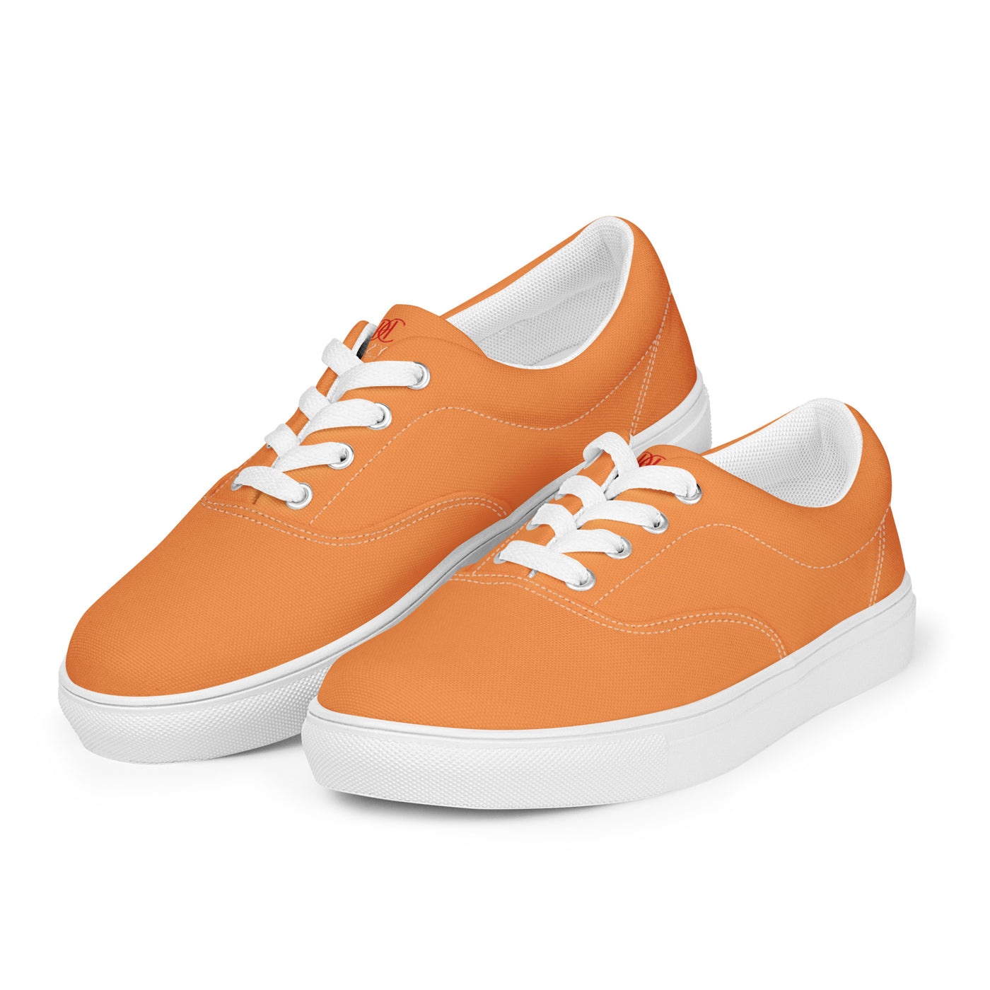 Orange lace-up canvas sneakers with white laces, white soles, and Cachy’s Urban branded insoles