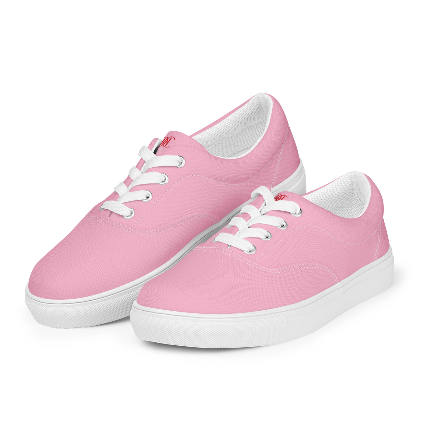 Bright pink lace-up canvas sneakers with white laces, white soles, and Cachy’s Urban branded insoles