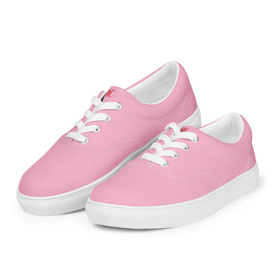 Bright pink lace-up canvas sneakers with white laces, white soles, and Cachy’s Urban branded insoles