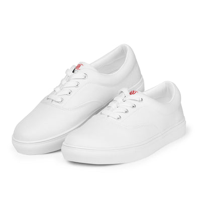 All-white lace-up canvas sneakers with minimalist design and subtle red Cachy’s Urban branding on the tongue