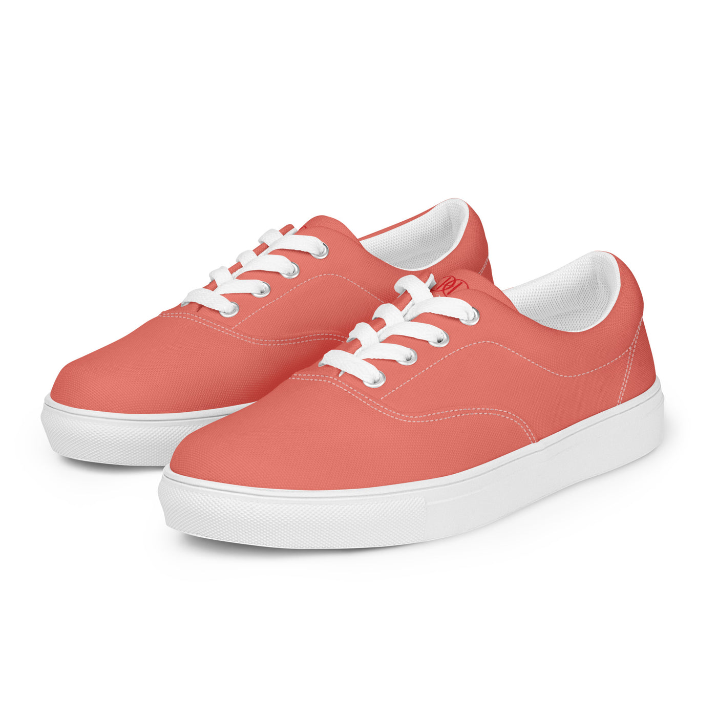 Salmon lace-up canvas sneakers with white laces, white soles, and Cachy’s Urban branded insoles