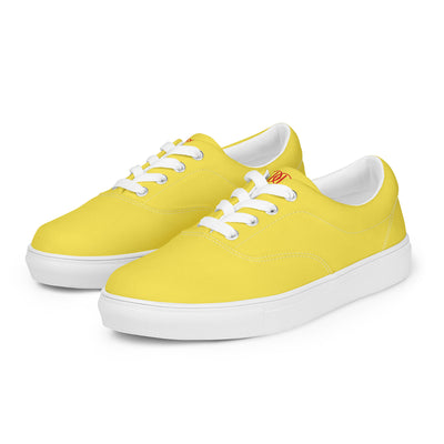 Yellow lace-up canvas sneakers with white laces, white soles, and Cachy’s Urban branded insoles