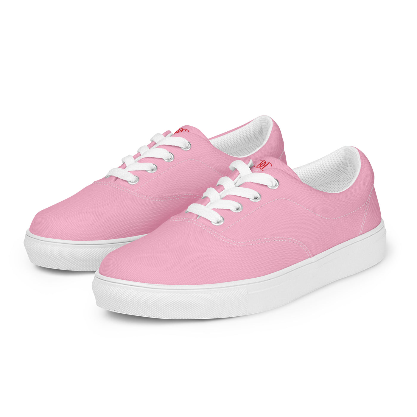 Bright pink lace-up canvas sneakers with white laces, white soles, and Cachy’s Urban branded insoles