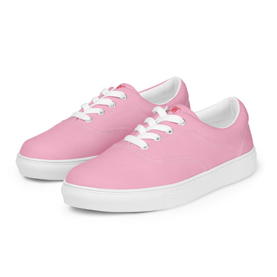 Bright pink lace-up canvas sneakers with white laces, white soles, and Cachy’s Urban branded insoles