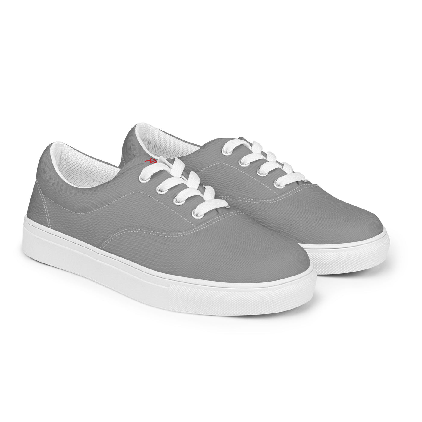 Grey lace-up canvas sneakers with white laces, white soles, and Cachy’s Urban branded insoles