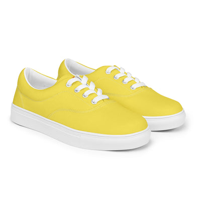 Yellow lace-up canvas sneakers with white laces, white soles, and Cachy’s Urban branded insoles
