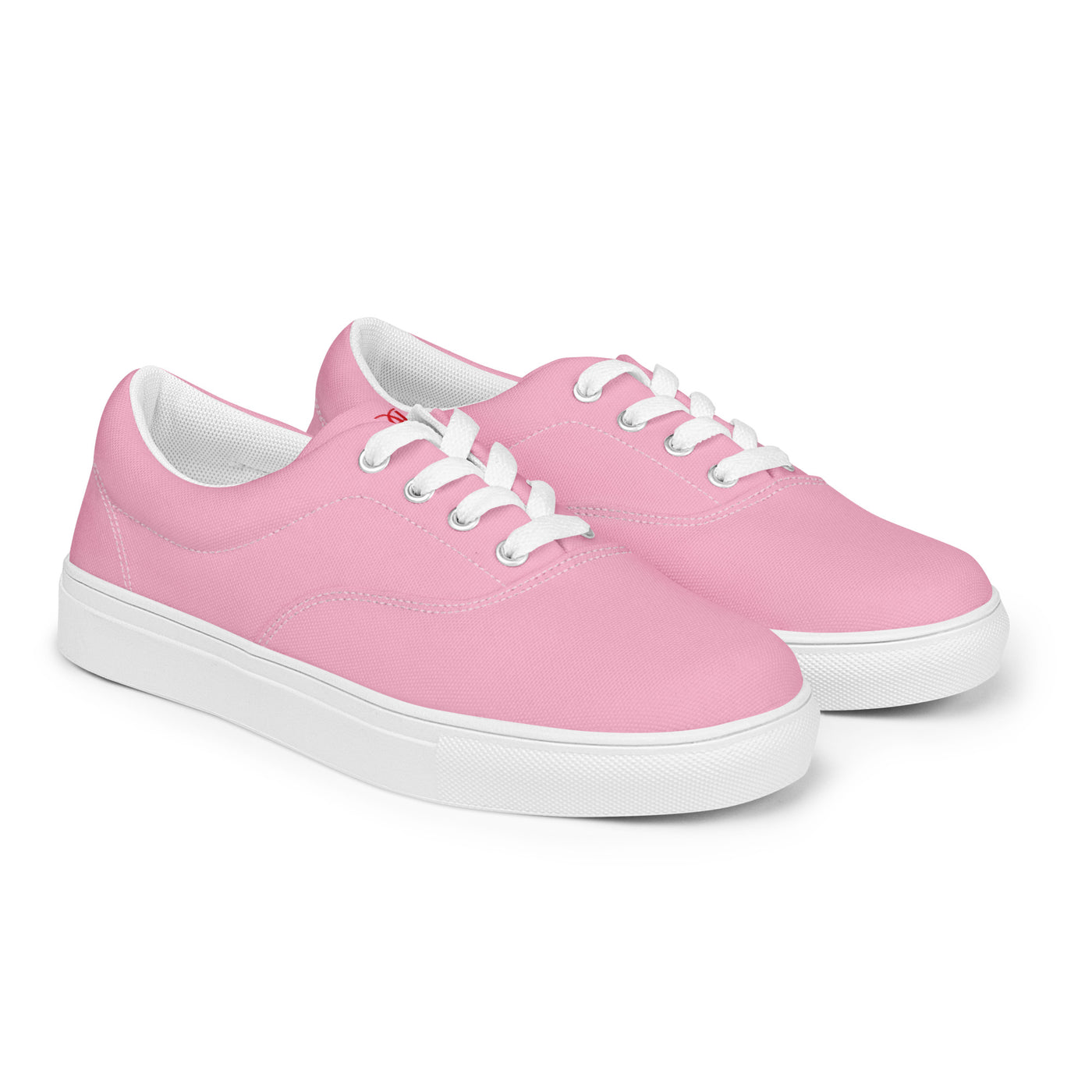 Bright pink lace-up canvas sneakers with white laces, white soles, and Cachy’s Urban branded insoles
