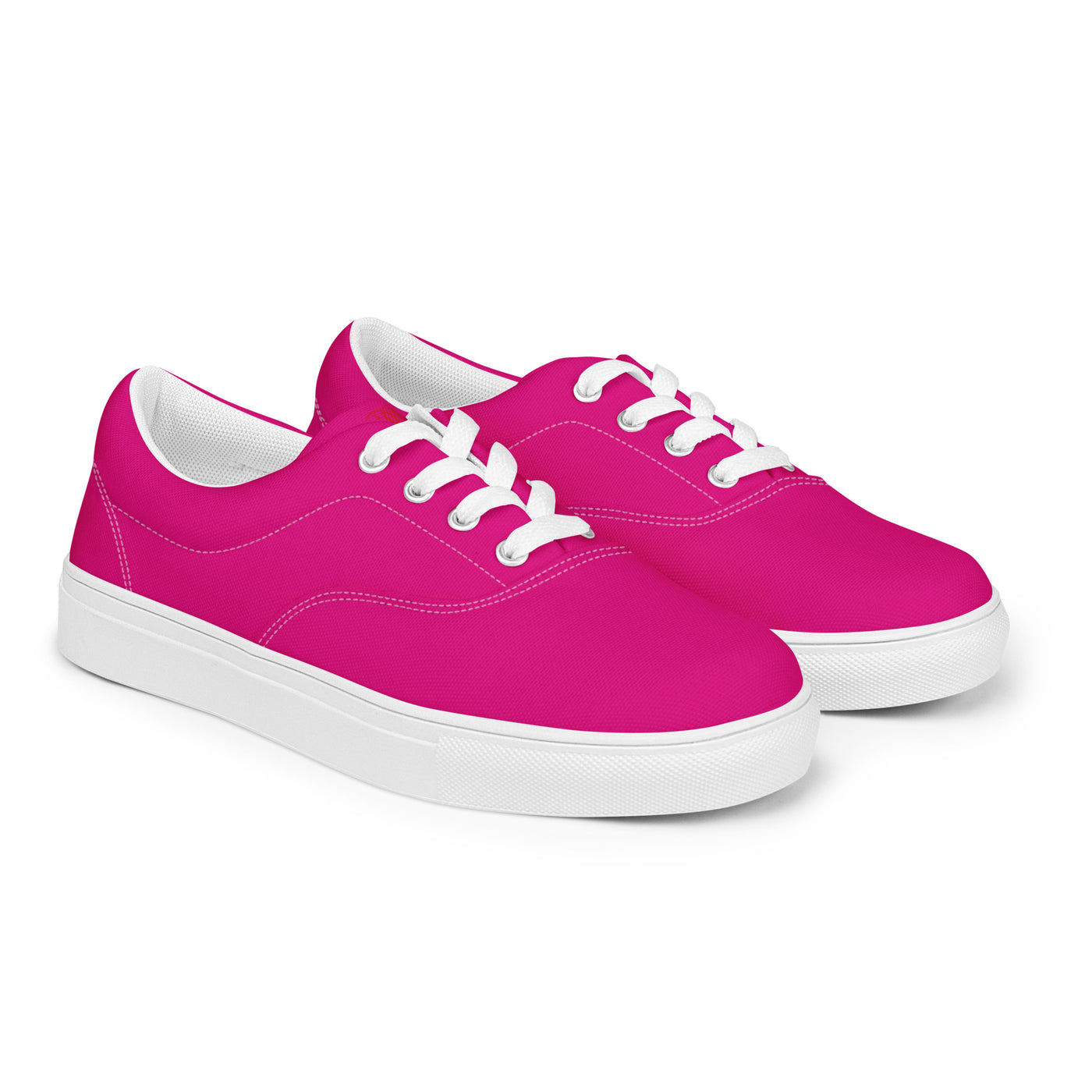 Bright pink lace-up canvas sneakers with white laces, white soles, and Cachy’s Urban branded insoles