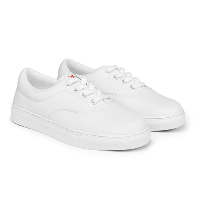 All-white lace-up canvas sneakers with minimalist design and subtle red Cachy’s Urban branding on the tongue
