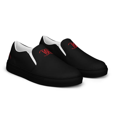 Black slip-on sneakers with red Cachy’s Urban logo on the upper, paired with black soles and white inner lining
