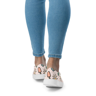 Cachy’s Urban slip-on canvas shoes with fun summer icons print (sunglasses, sun, drinks) on a light background, casual streetwear sneakers
