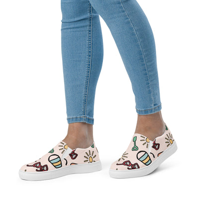 Cachy’s Urban slip-on canvas shoes with fun summer icons print (sunglasses, sun, drinks) on a light background, casual streetwear sneakers