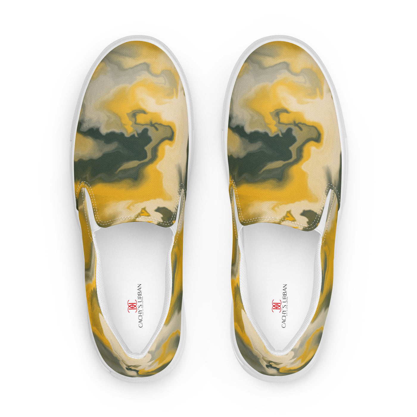 Slip-on canvas shoes with abstract camouflage pattern in yellow, green, and gray tones, featuring Cachy’s Urban branding on the insoles