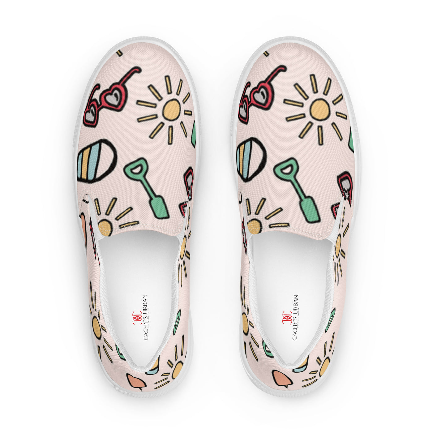 Pink slip-on canvas shoes with playful summer icons featuring suns, sunglasses, and shovels in a cartoon style