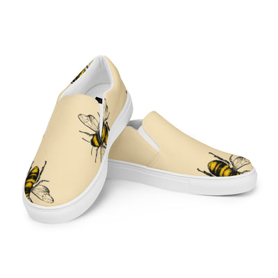 Cachy’s Urban beige slip-on sneakers with bold bee print design and white sole