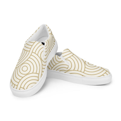 Cachy’s Urban white slip-on sneakers with minimalist golden concentric circle pattern and white sole