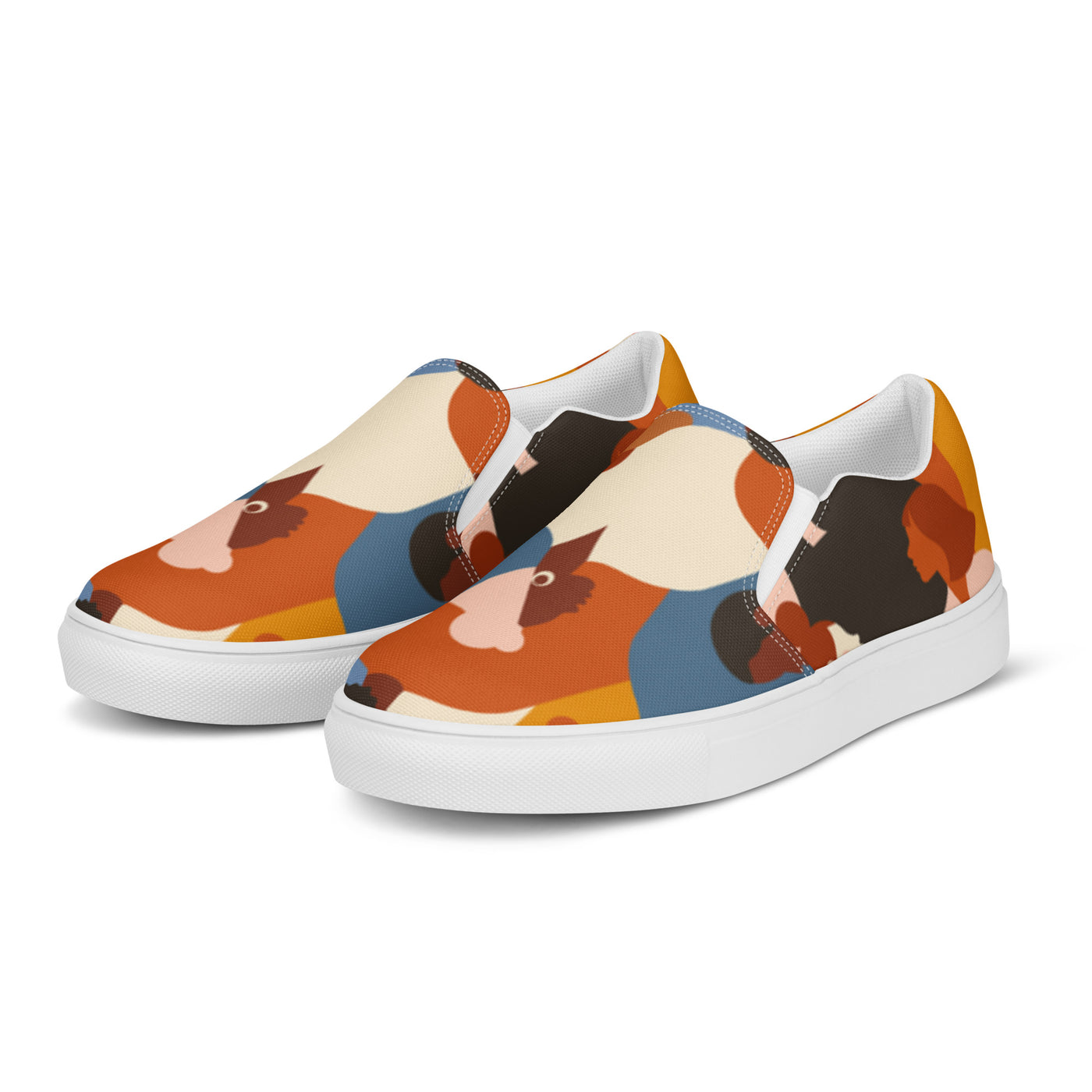Slip-on canvas shoes with tribal-style multicolor abstract pattern featuring diverse human silhouettes in earthy tones and Cachy’s Urban branded insoles