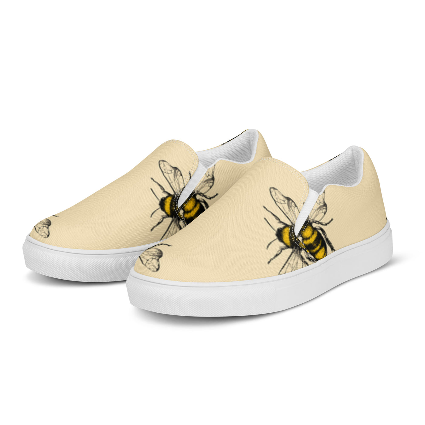 Beige slip-on canvas shoes with a bold bee pattern design and Cachy’s Urban branded insoles