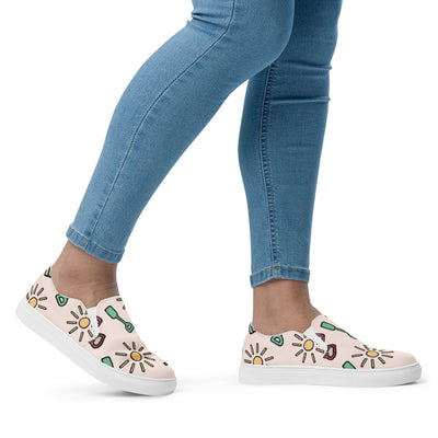 Cachy’s Urban slip-on canvas shoes with fun summer icons print (sunglasses, sun, drinks) on a light background, casual streetwear sneakers