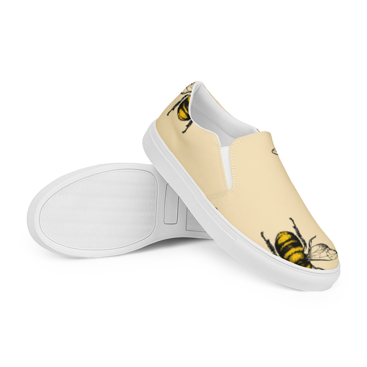 Cachy’s Urban beige slip-on sneakers with bold bee print design and white sole