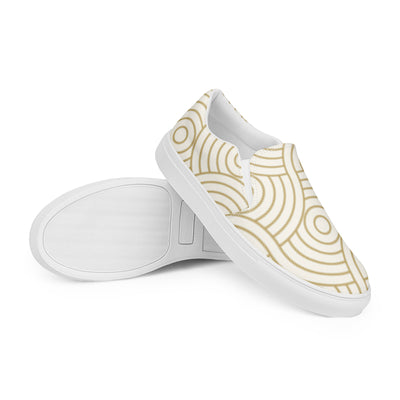 Cachy’s Urban white slip-on sneakers with minimalist golden concentric circle pattern and white sole